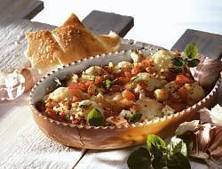 Baked cauliflower with tomatoes and feta cheese recipe