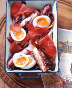 Braised chicory with bacon and egg