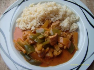 Pork with paprika cabbage vegetables in cream sauce with rice