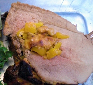 Roast veal stuffed with mushrooms and yellow peppers