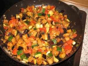 Vegetable stirfry with eggplant zucchini and tomatoes