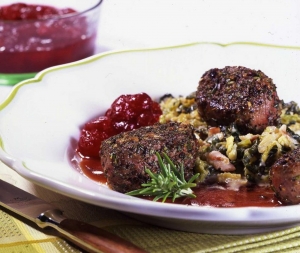 Venison steaks with creamed Savoy cabbage and cranberry sauce