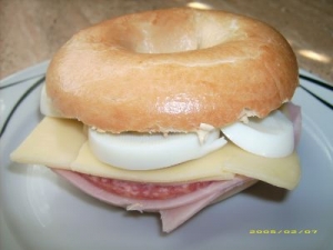 Bagel with salami ham cheese and egg