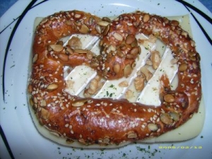 Pretzel with cheese and three kinds of sprouts chopped walnuts