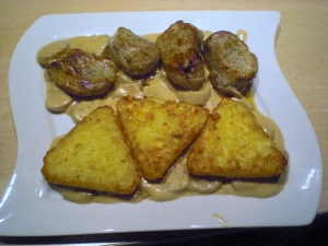 Pork Medallions with hash browns and porcini mushroom sauce