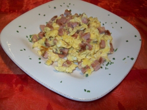 Scrambled eggs with sausage and parmesan cheese