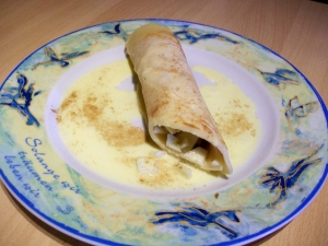Sweet pancakes filled with apples and cinnamon with vanilla sauce Crpes recipe