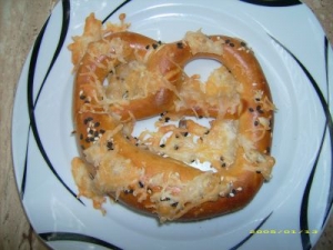 Baked cheese pretzel with sesame and sunflower seeds