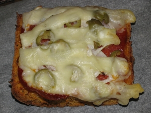 Ciabatta bread with salami olives and onion gratin