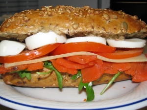 Euroweck covered with smoked salmon cheese tomato egg and arugula
