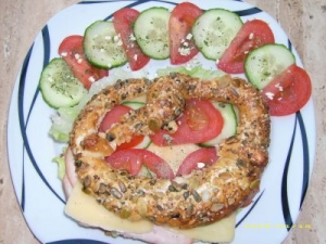 Fitness pretzel with cheese turkey breast tomato and cucumber