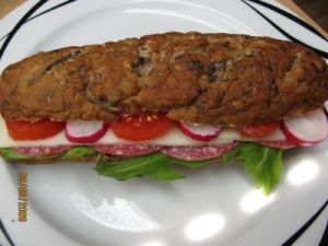 Vital multigrain pretzel stick with cheese salami arugula tomatoes and radishes